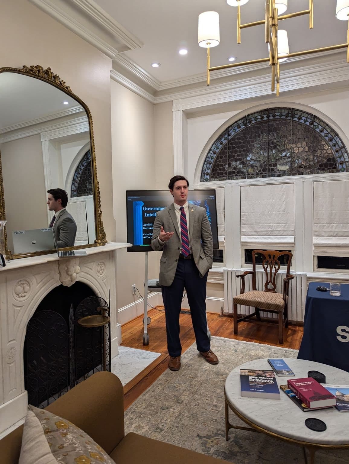 Colin Raby speaking to the DC Legal Hackers group at the Sunwater Institute, a fireplace beside him