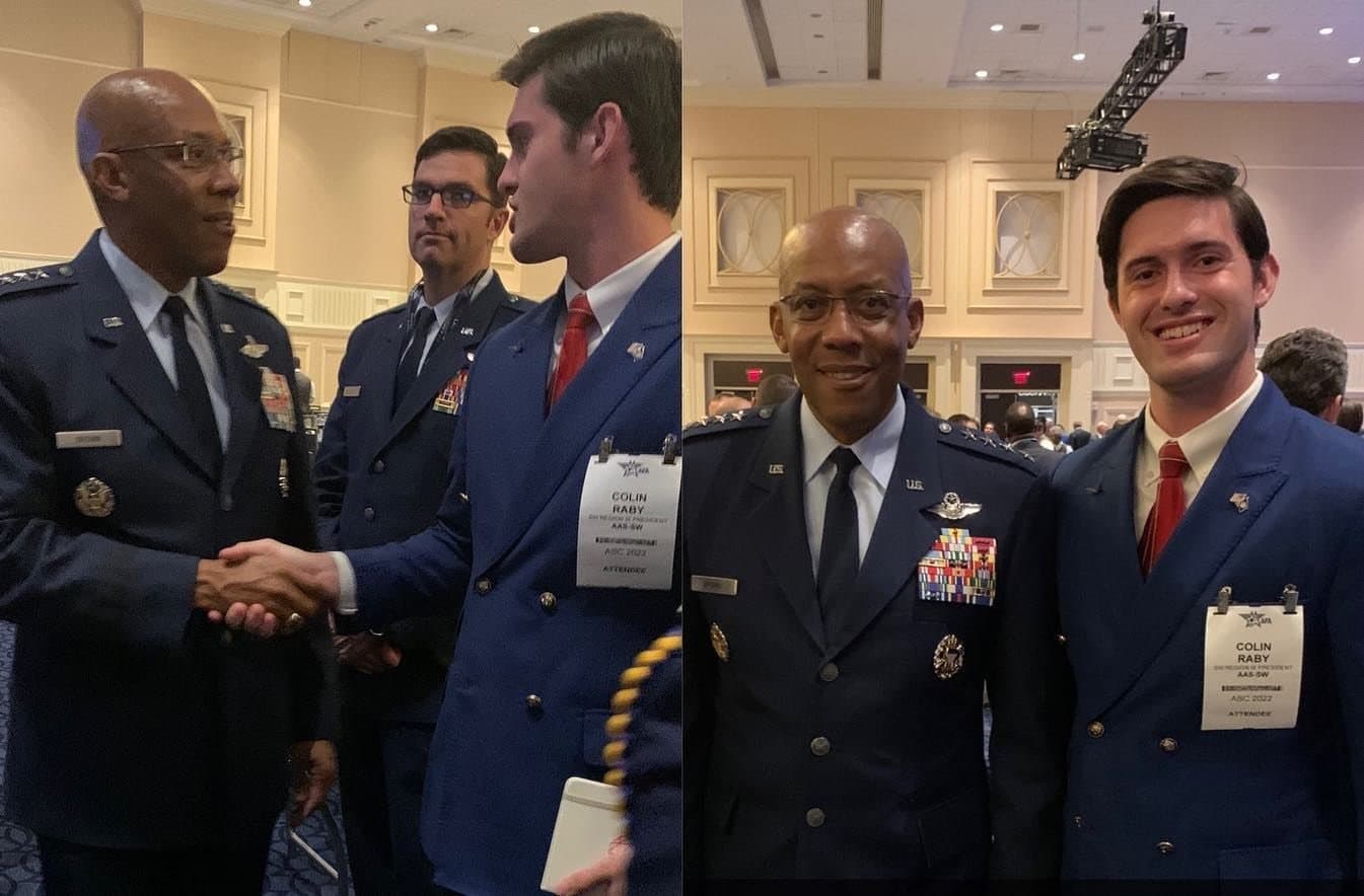Colin Raby shaking hands with a four-star Air Force general, and posing with him