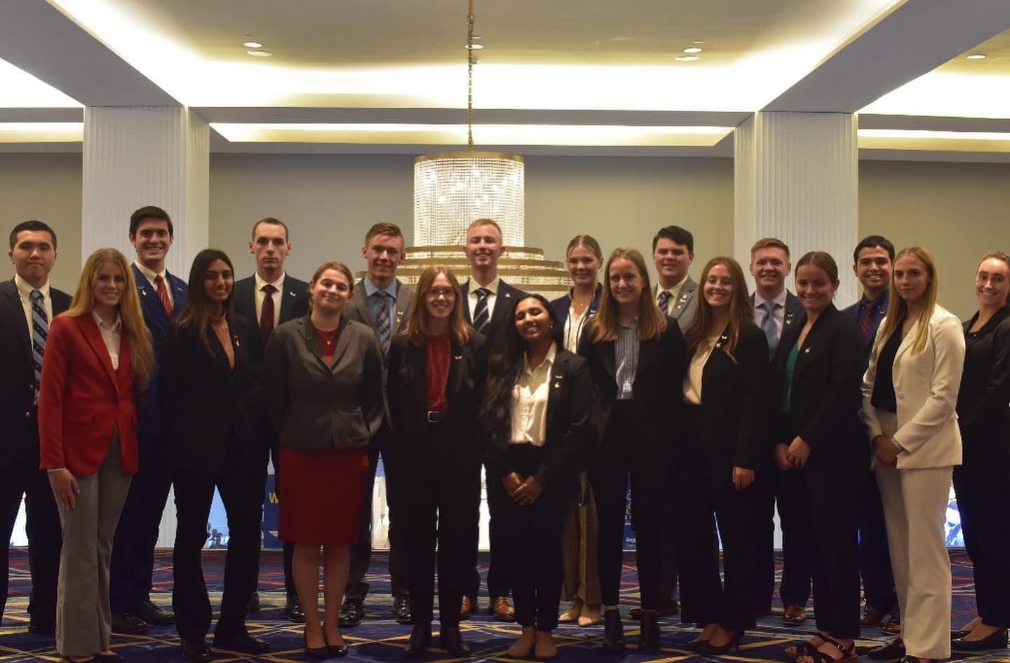 Silver Wings and Arnold Air Society national and regional leaders in a group photo in a hotel ballroom